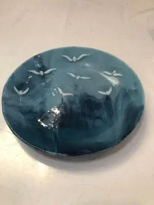 11" Blue swirly bowl with birds enjoying the view.