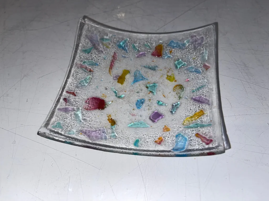 Small dish – clear with multi-colored small pieces 4.5″ Square - Fused Glass