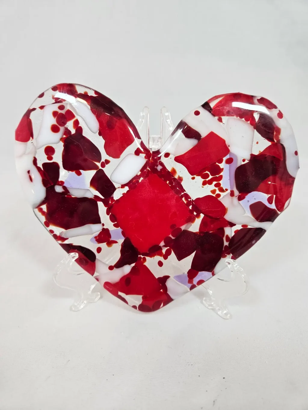 The Passionate Heart is a heart-shaped glass plate with a mosaic pattern of red, white, and purple.